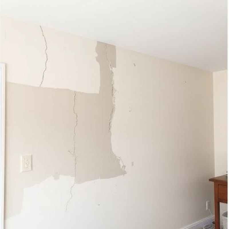 Damaged drywall before repair
