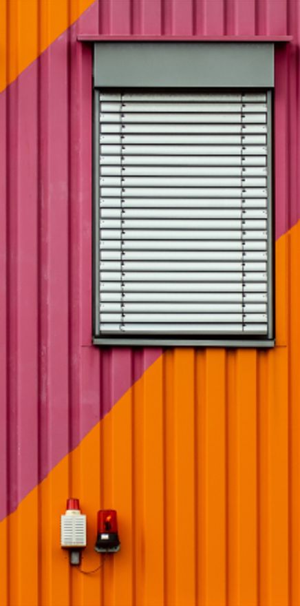 Outside of building painted orange and purple
