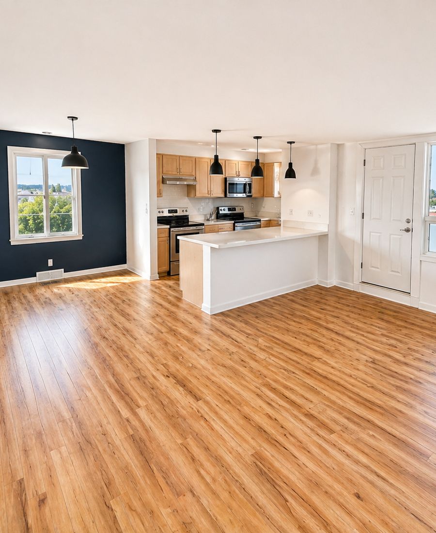 Kitchen repaint with navy accent wall, white cabinetry, and refreshed trim in Orléans