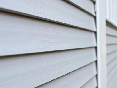 Painted aluminum siding and metal trim close-up